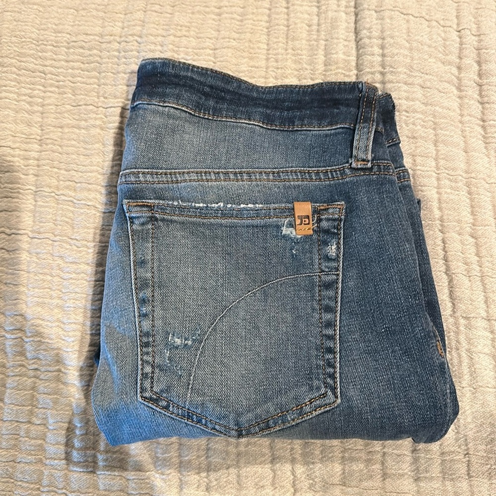 Joes Jeans size 27. Distressed jean with a darker denim cuff. Cropped
